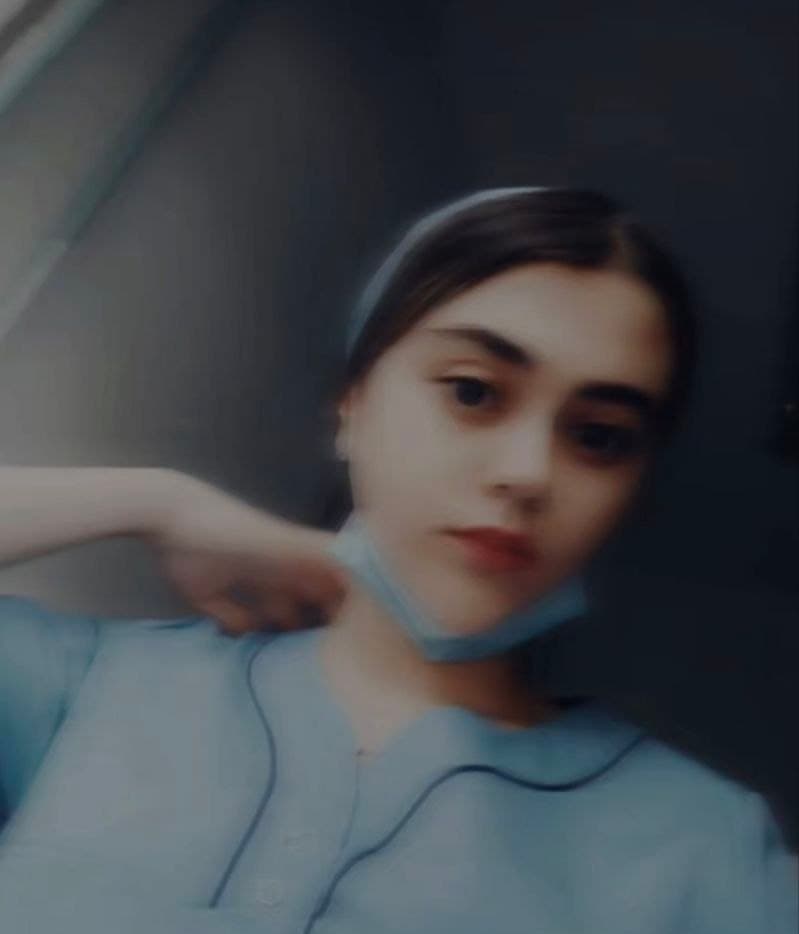 Salimshoeva в голубой медицинской форме и маске